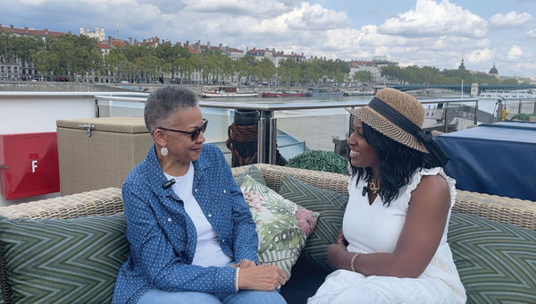 Travel Weekly's Nicole Edenedo (right) sits down with Joyce Montague, a guest onboard the AmaKristina.