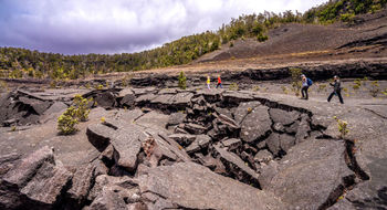 Kilauea Iki hikers cross the crater floor at Hawaii Volcanoes National Park.